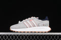 Side view of gray adidas Retropy E5 sneakers with pink stripes, navy heel accents, and character graphics
