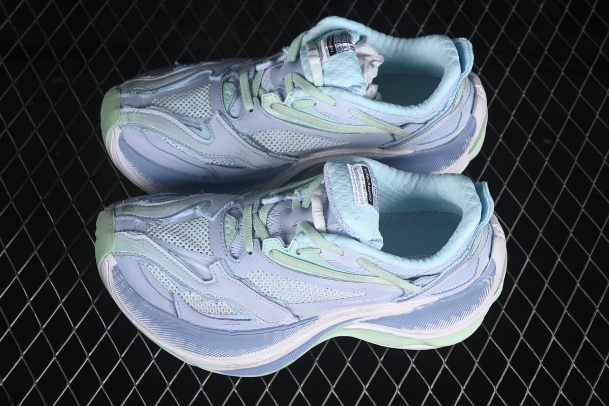 Top three-quarter view of the pair showing the layered panels, mesh sections and contrasting laces.