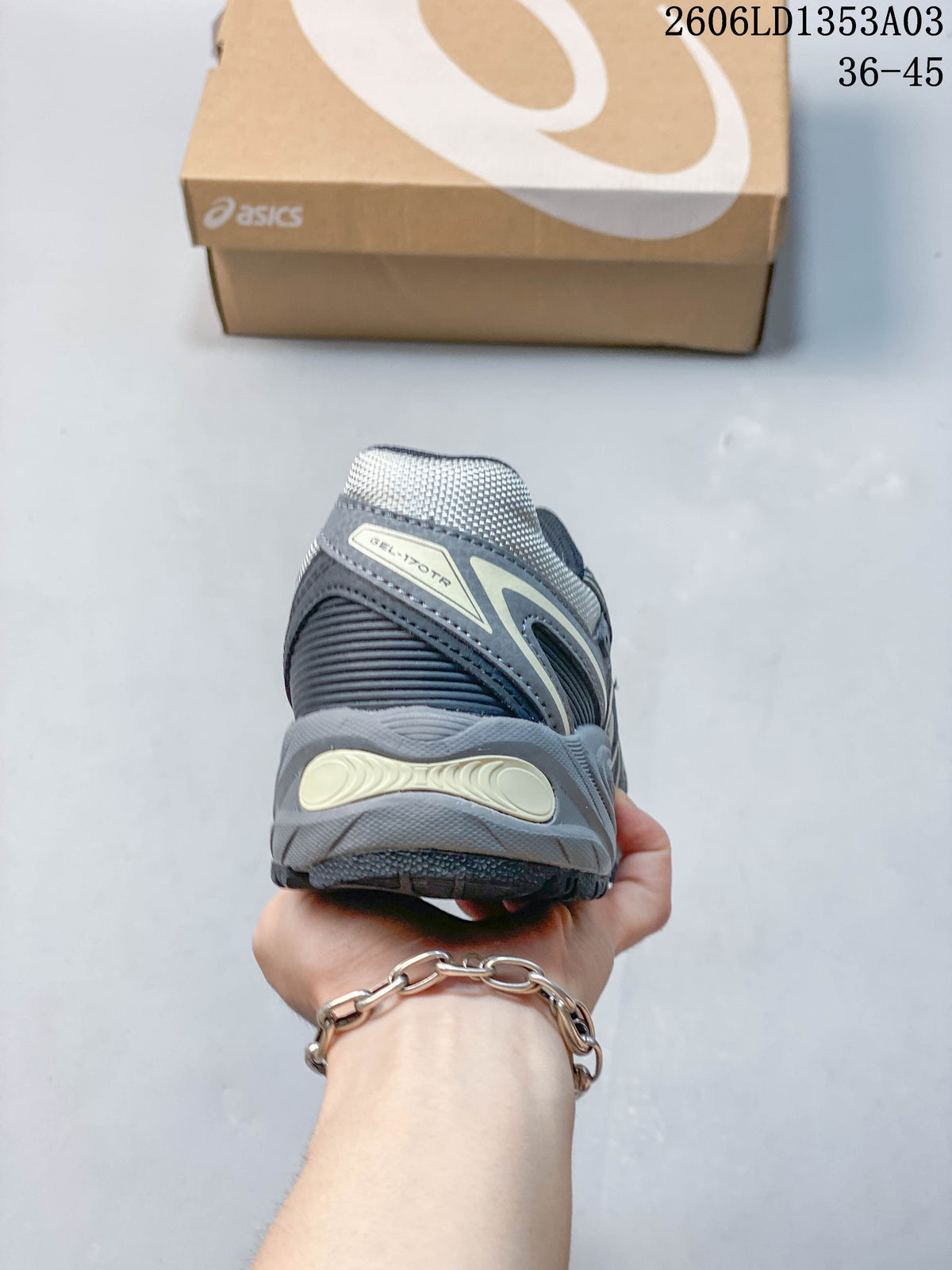 Rear view showing the heel details of a grey ASICS GEL-170TR sneaker.