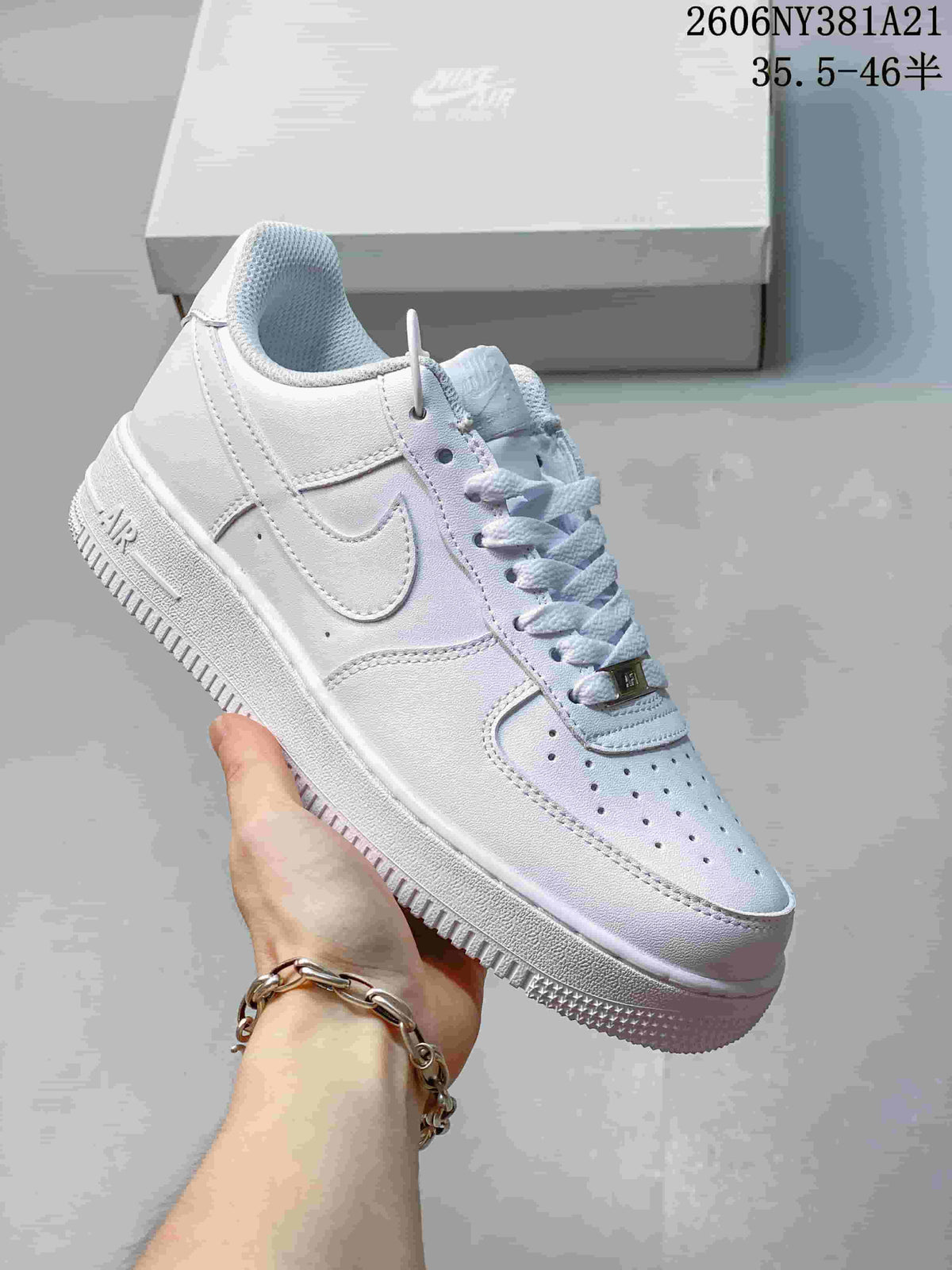 Angled view of a white low-top sneaker with side Swoosh and textured outsole