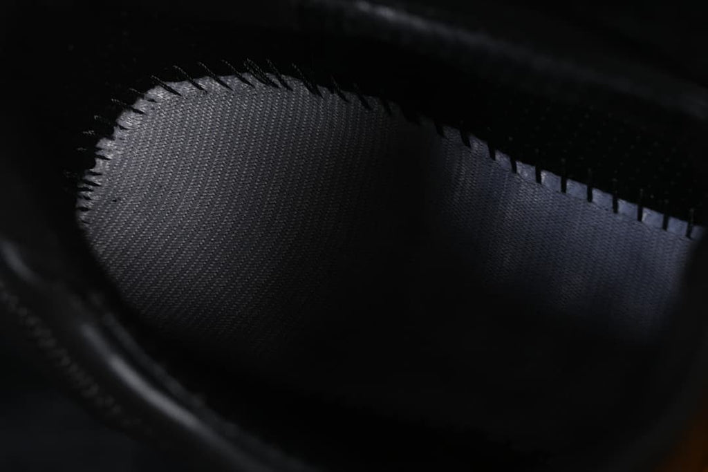 Close-up view inside the shoe showing its dark lining