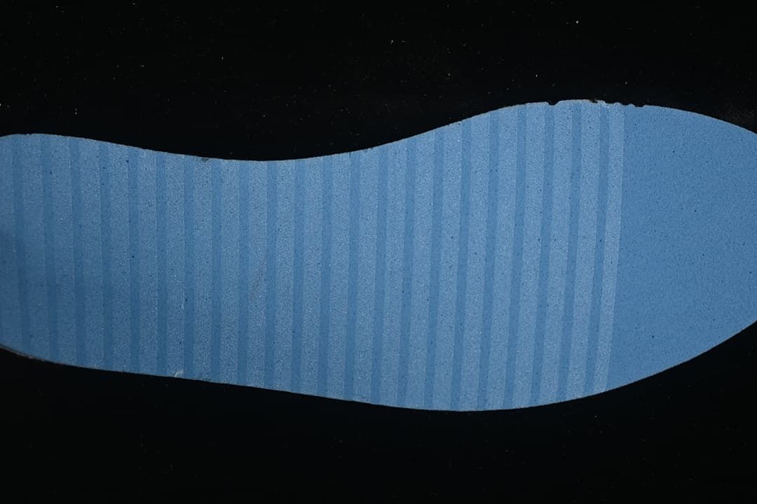 Blue textured shoe insole shown from above