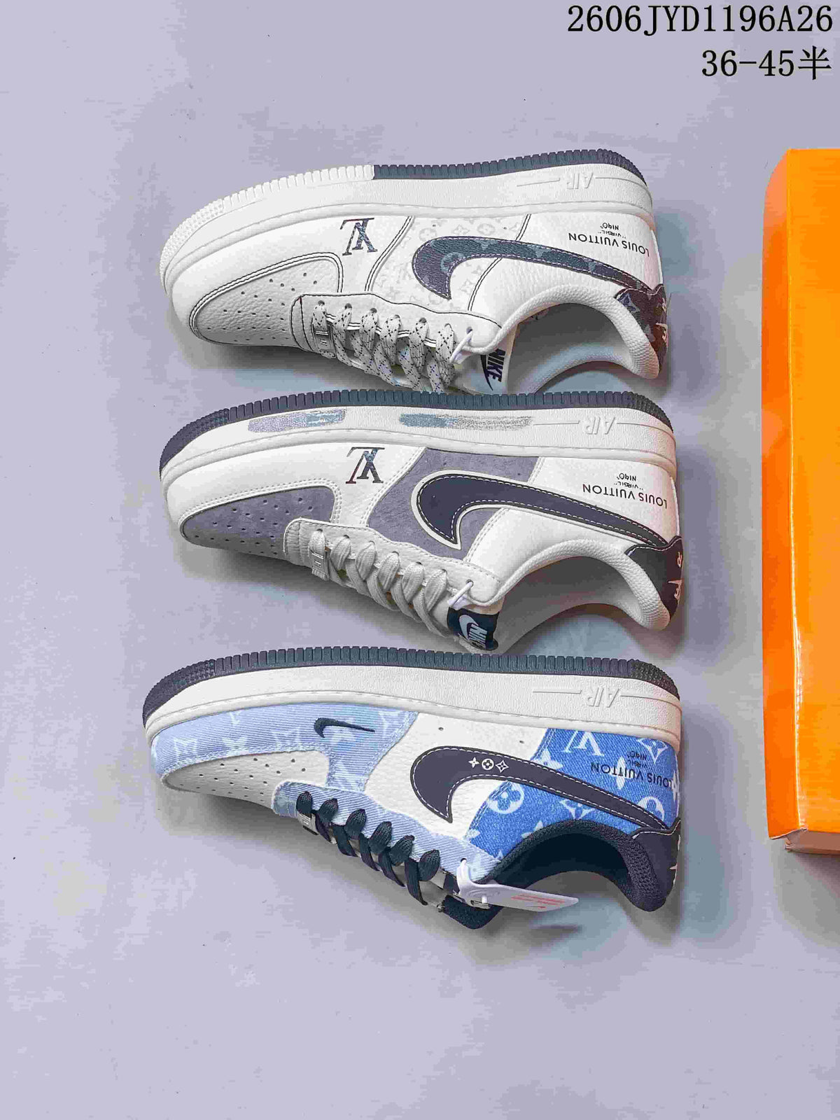 Blue-and-white pair of low-top sneakers with dark laces and patterned panels, displayed on an orange box.