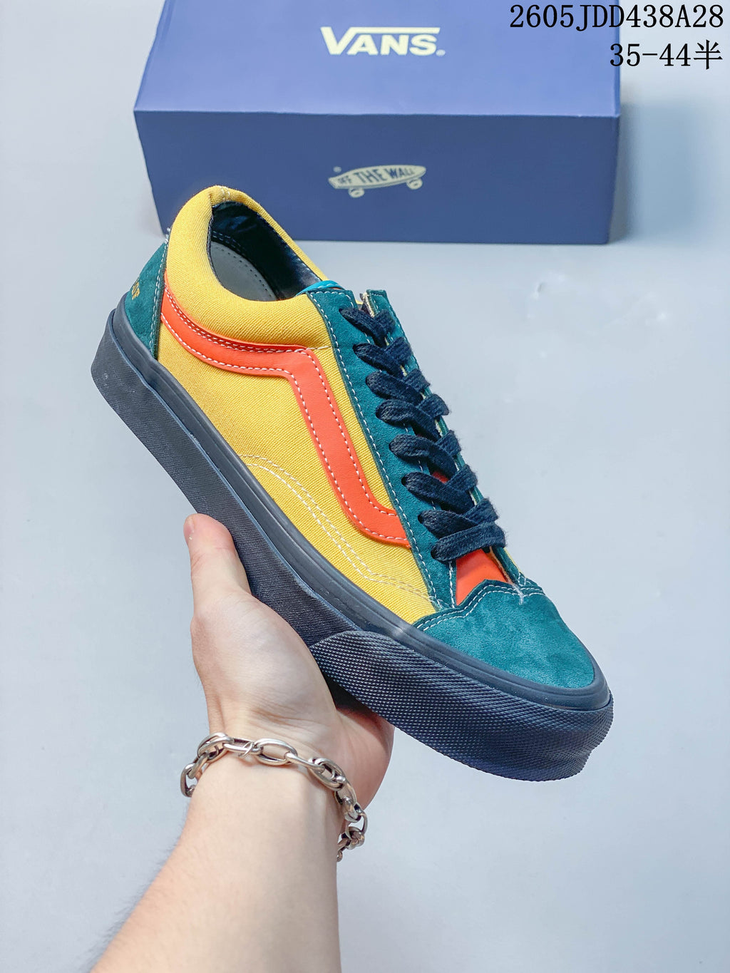 Side view of a yellow, teal, and orange Vans OTW Old Skool 36 sneaker.