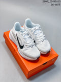 Pair of white Nike Air Zoom Pegasus 42 running shoes with dark Swoosh accents on an orange shoebox