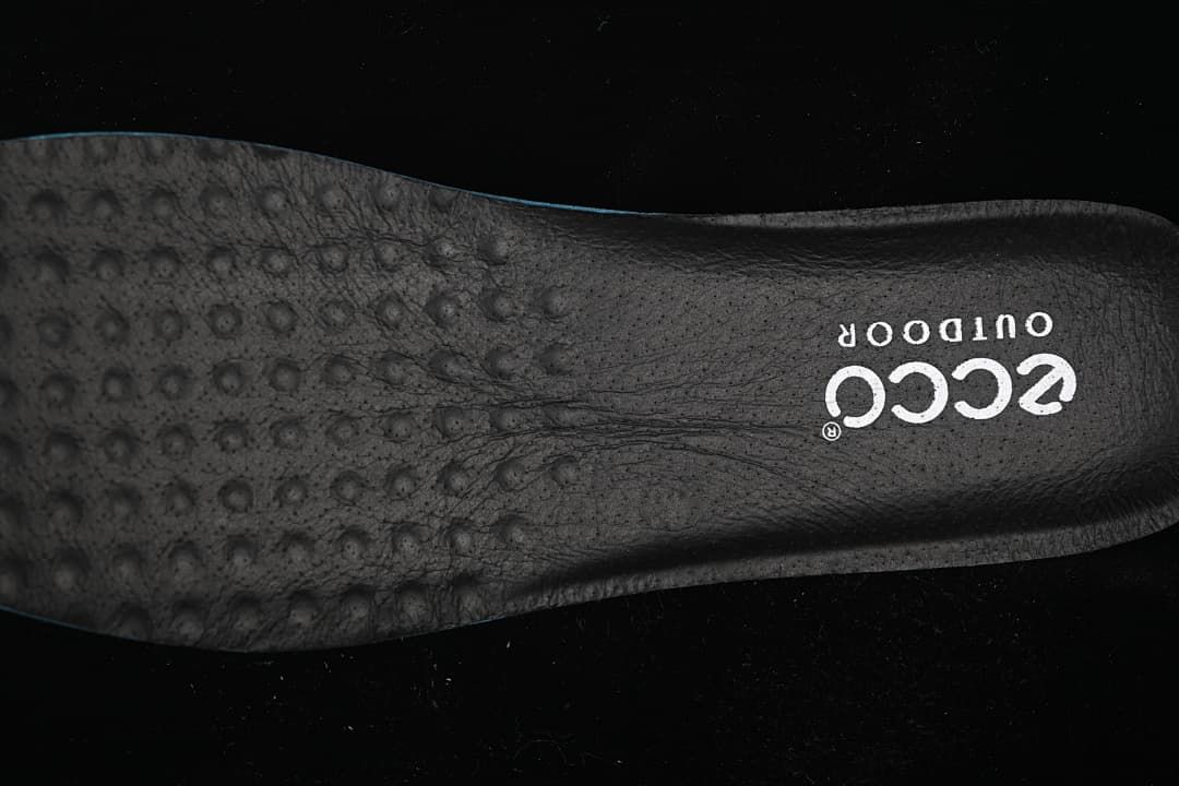 Close-up of a dark ECCO insole with visible ECCO Outdoor branding