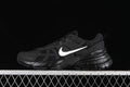 Black Nike V2K Run sneaker with a white Swoosh, shown in side profile.