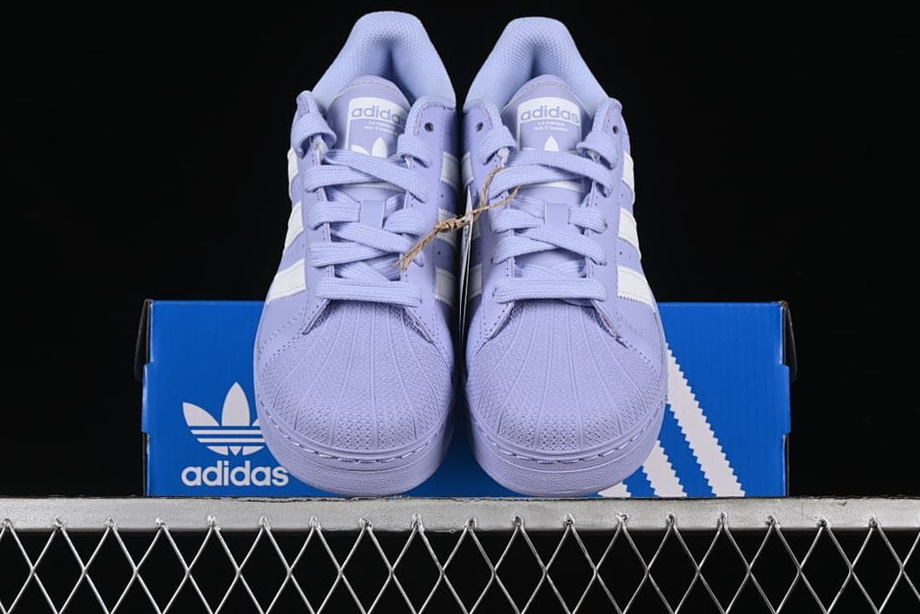 Front view of the pair showing the shell toes, laces, and thick soles