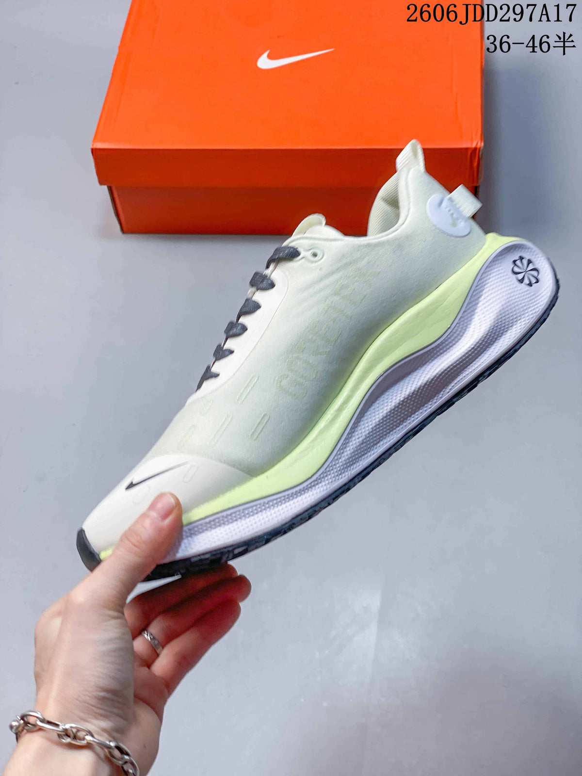 Side profile of a pale white Nike InfinityRN 4 shoe with lime midsole accents