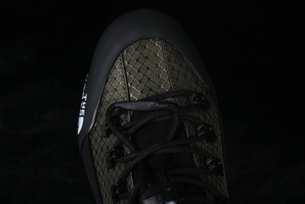 Top view of the patterned toe, laces, and black toe overlay