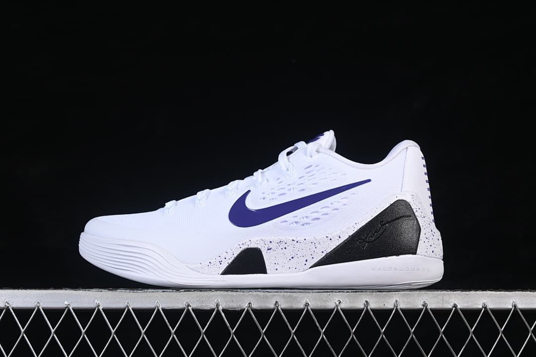 Side profile of a white Nike Kobe 9 Stitches Low shoe with purple swoosh