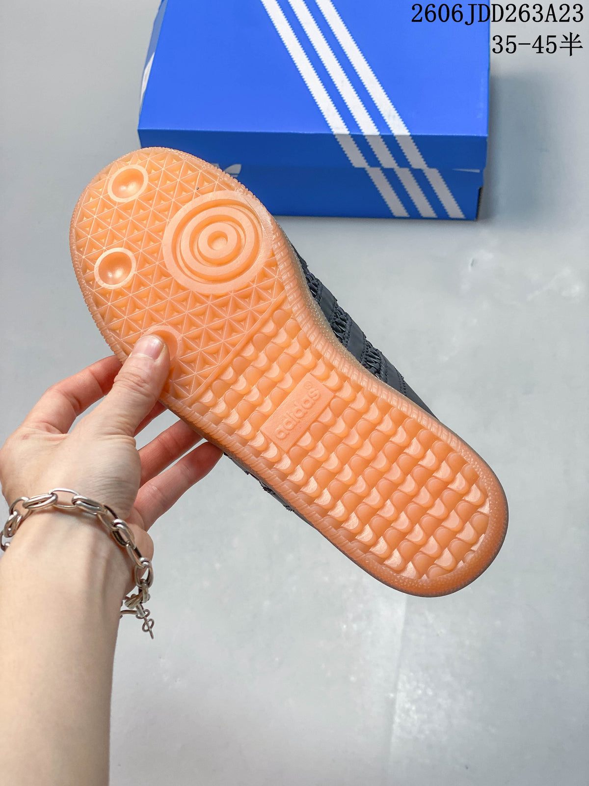 Underside of a Samba OG Mule showing the textured translucent gum-colored sole