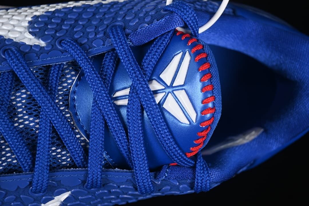 Close-up of blue laces and tongue with Kobe logo and red stitching