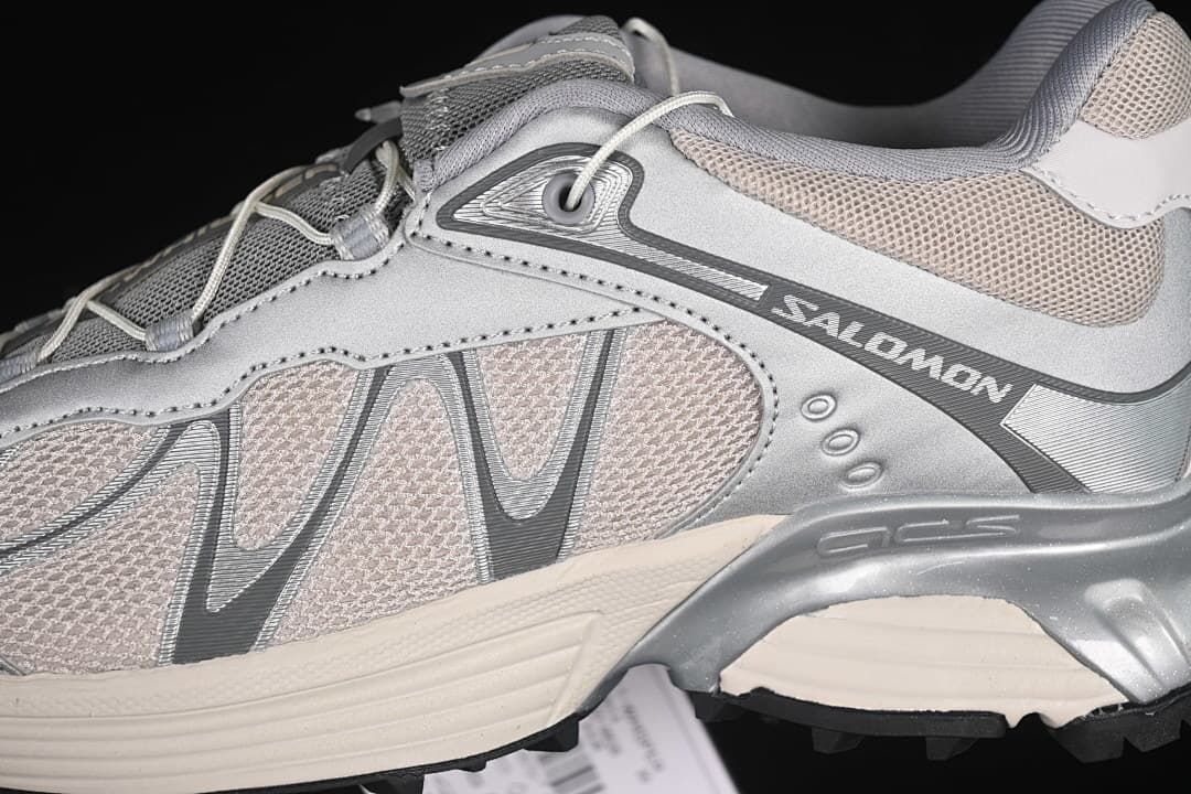 Close-up of the layered side panels and Salomon branding.