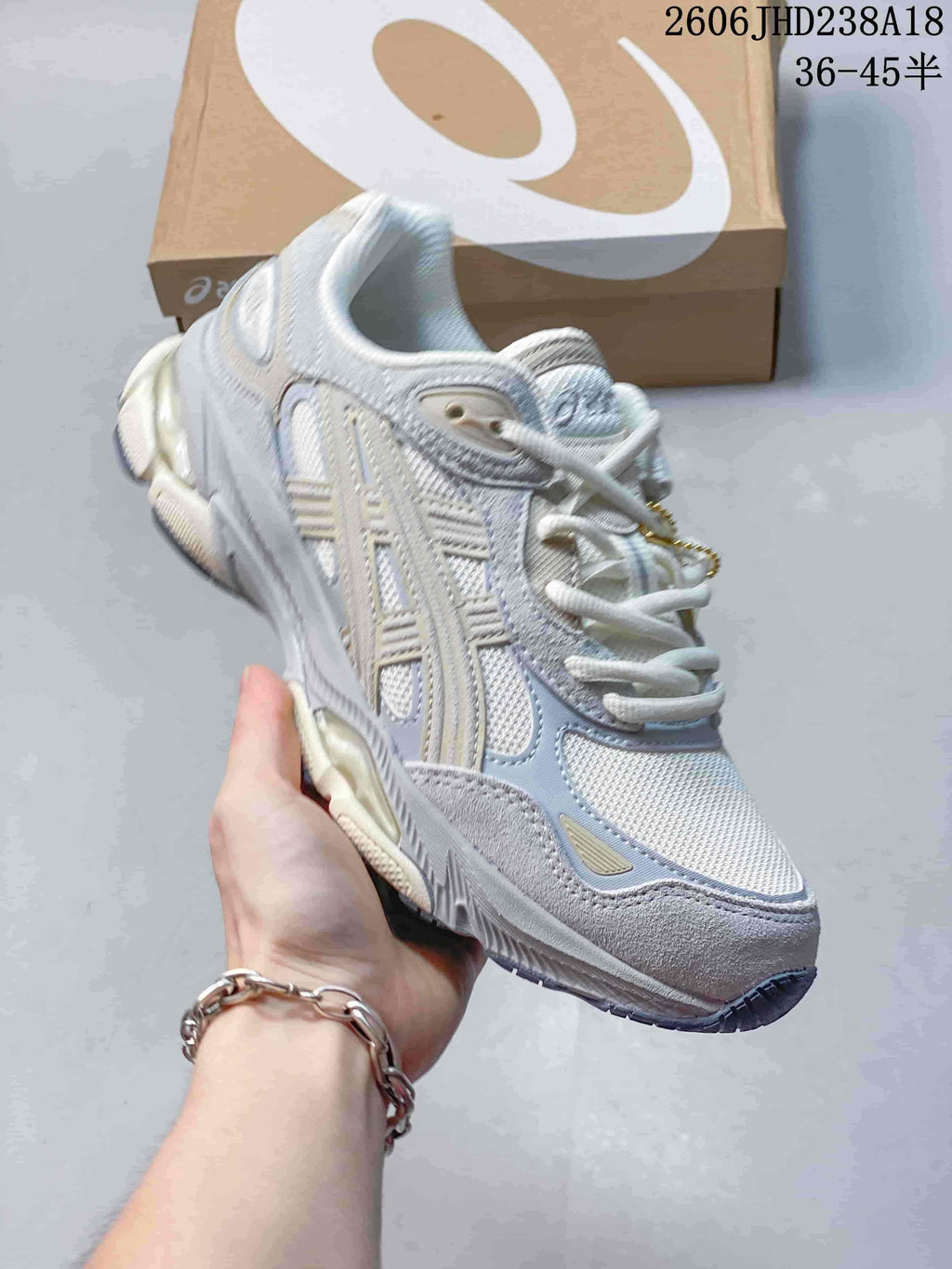 Side view of a white and lavender mesh sneaker with a sculpted sole