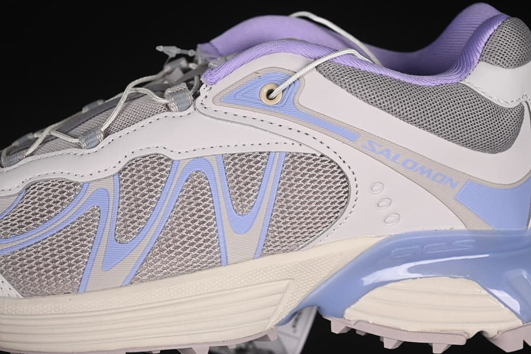 Close-up of the side panels, mesh, and Salomon branding.