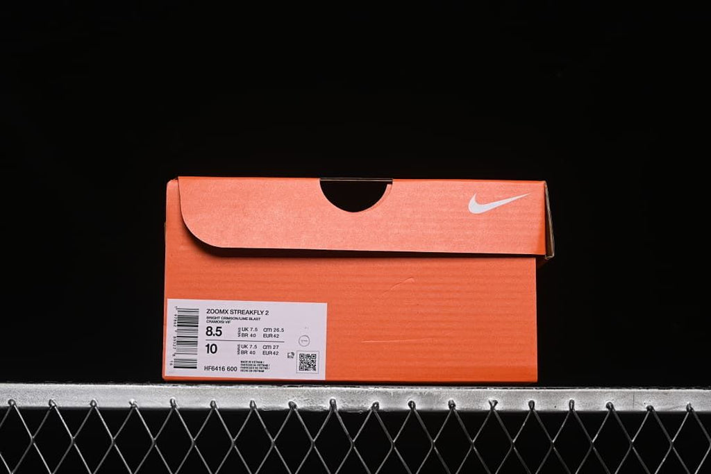 Orange shoebox with a label identifying ZoomX Streakfly 2 and size details.
