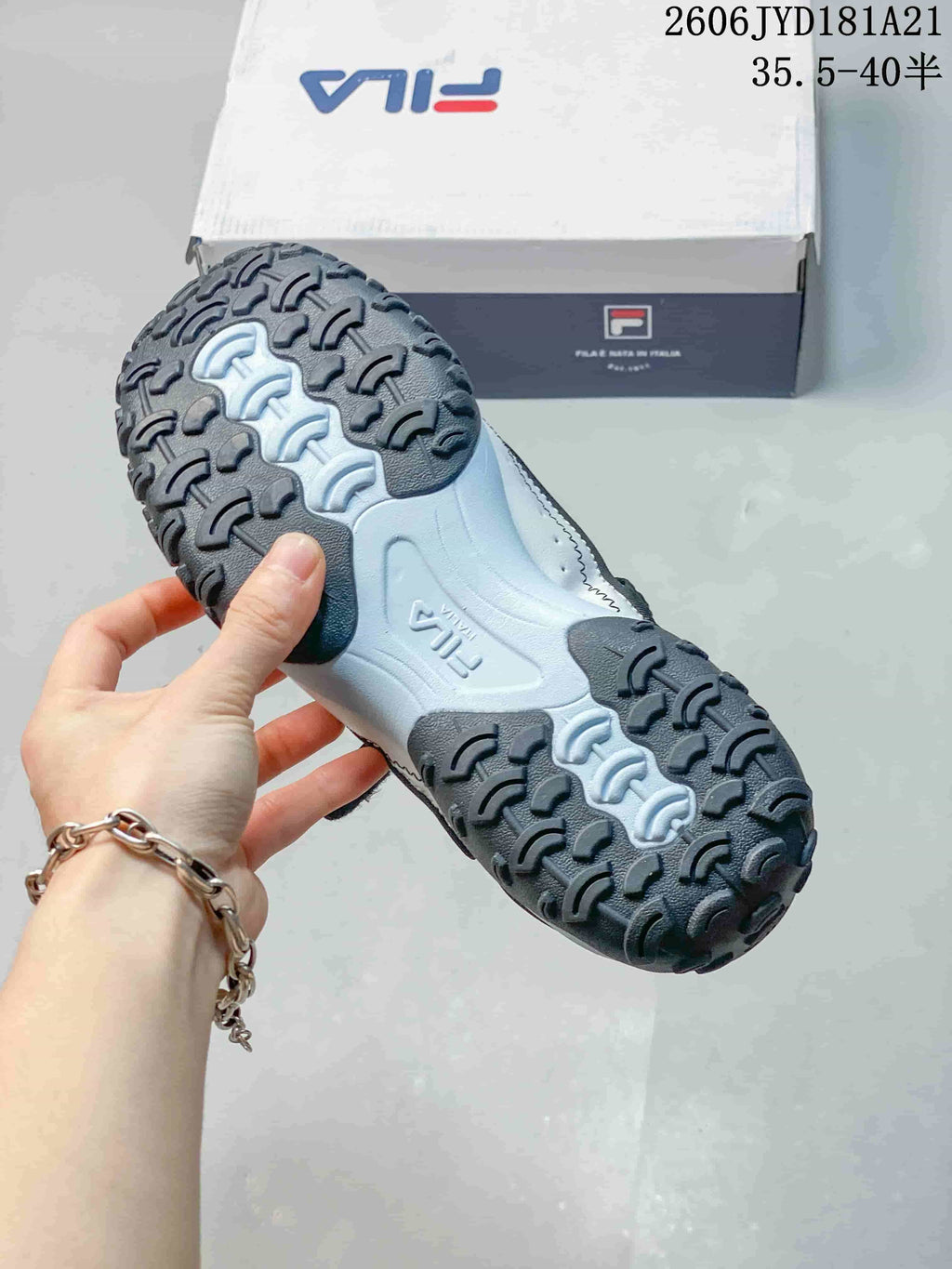 Close-up of the FILA Pebble sandal outsole and raised tread.