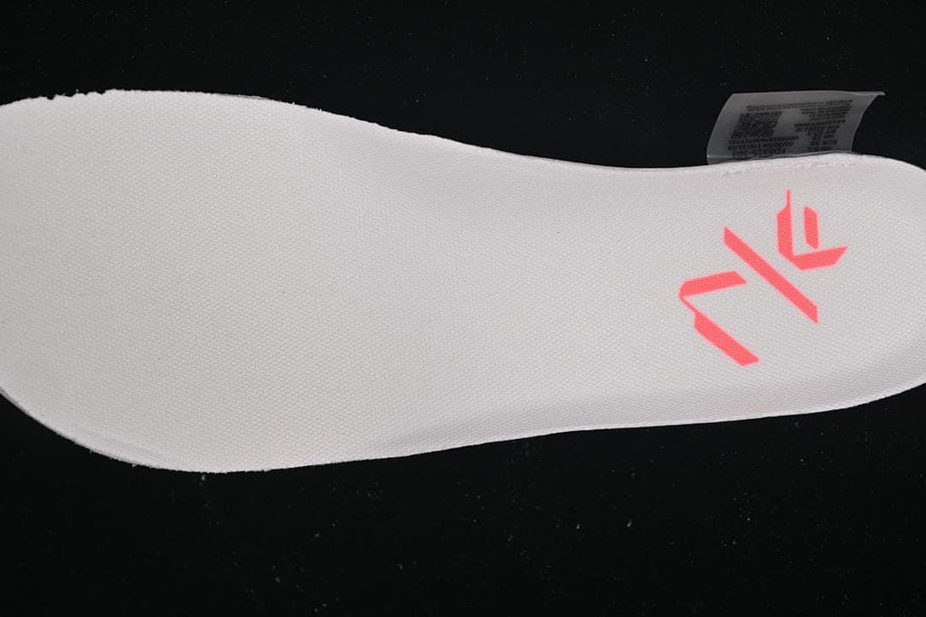 Close-up of a white shoe insert with a coral graphic