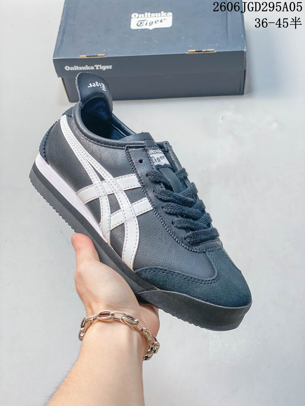 Several Onitsuka Tiger low-top sneakers in assorted color combinations arranged in a circle