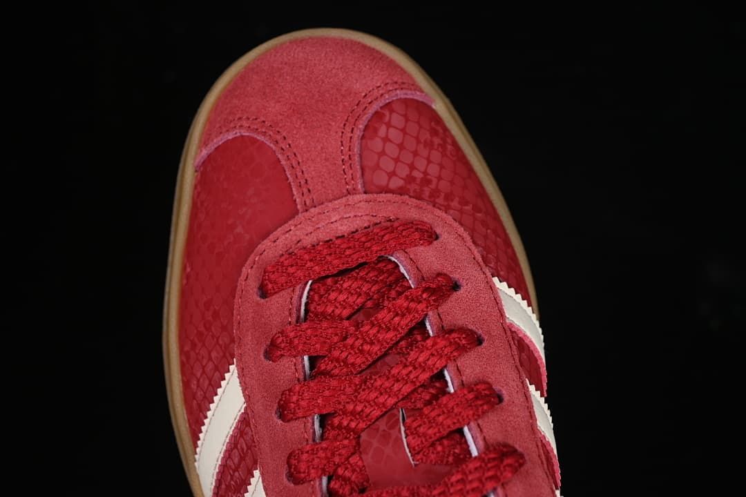 Top-down close-up of the red toe and lace area