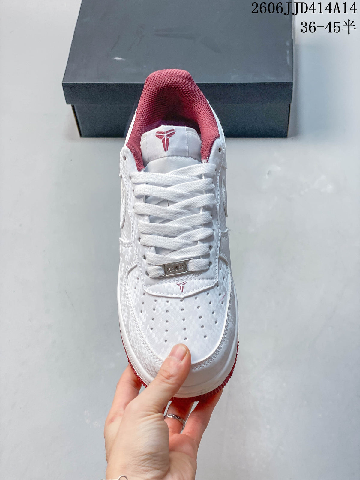Top view showing white laces, a perforated toe, and burgundy-red collar lining