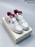 Pair of Jordan Stadium 90 sneakers in white, pale grey, green and burgundy, shown on a box