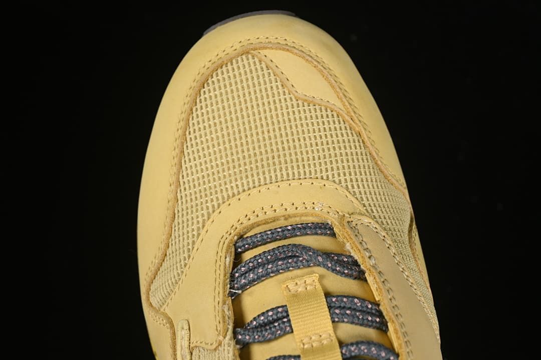 Top-down close-up of the mesh toe box and laces.