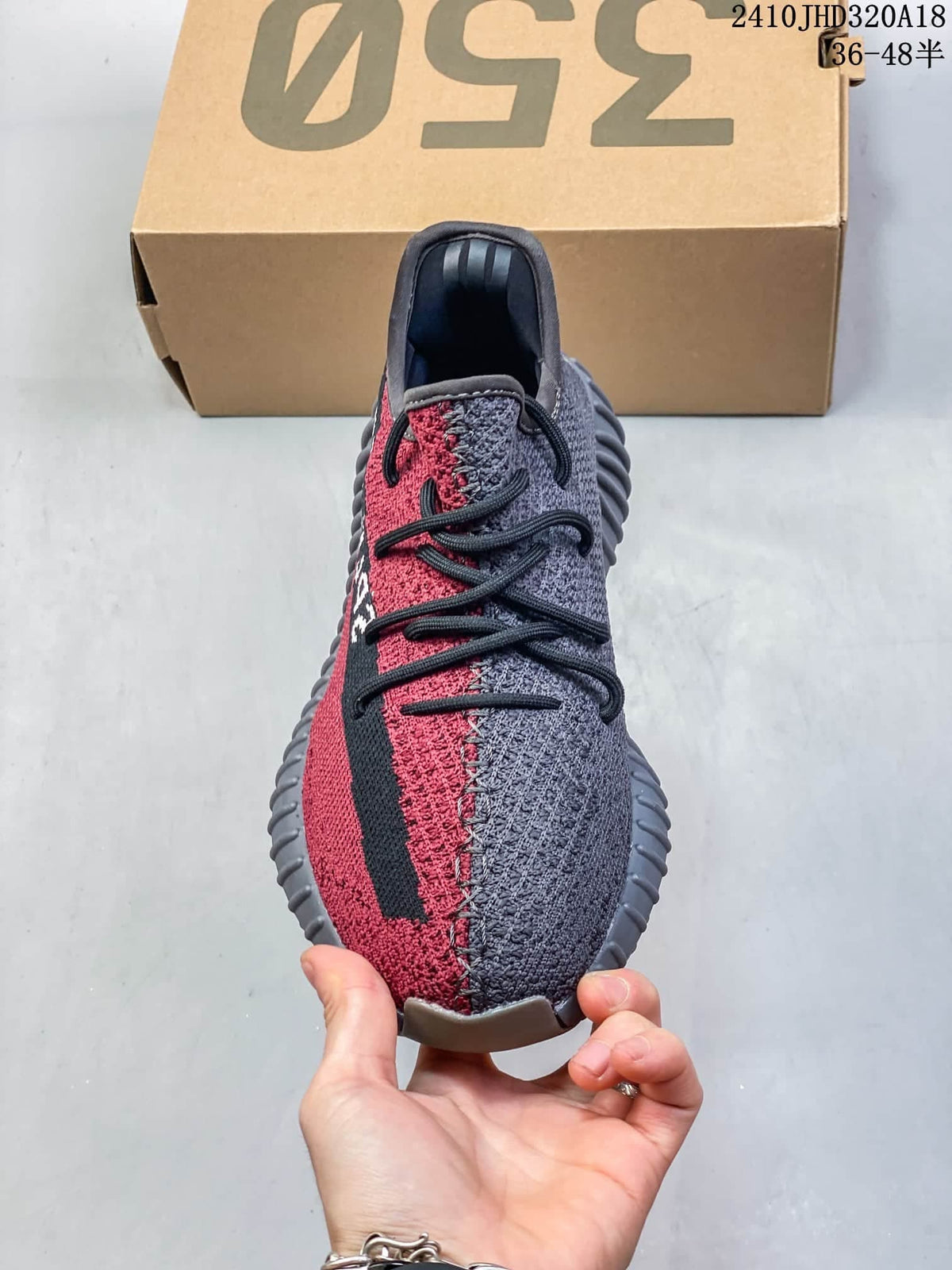 Front view showing the gray and red color-blocked upper and black laces