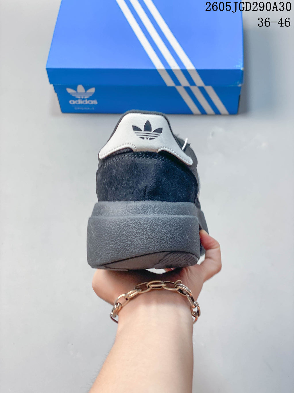 Rear view showing the raised sole and contrasting heel tab of the SL 72 Pro sneaker.