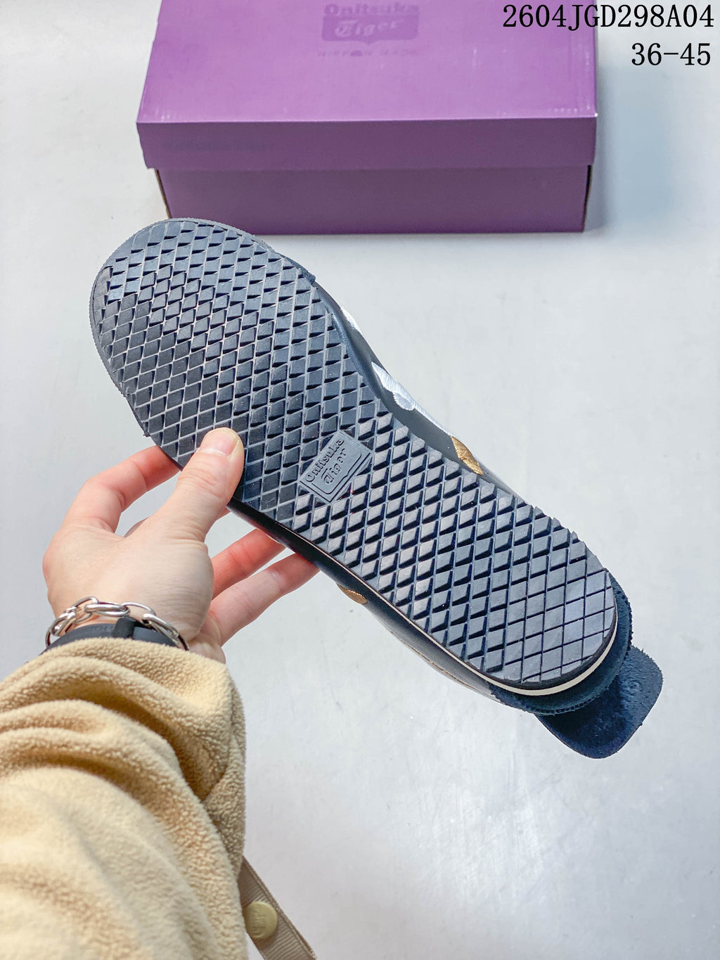 Textured outsole of a navy Onitsuka Tiger Mexico 66 Deluxe sneaker