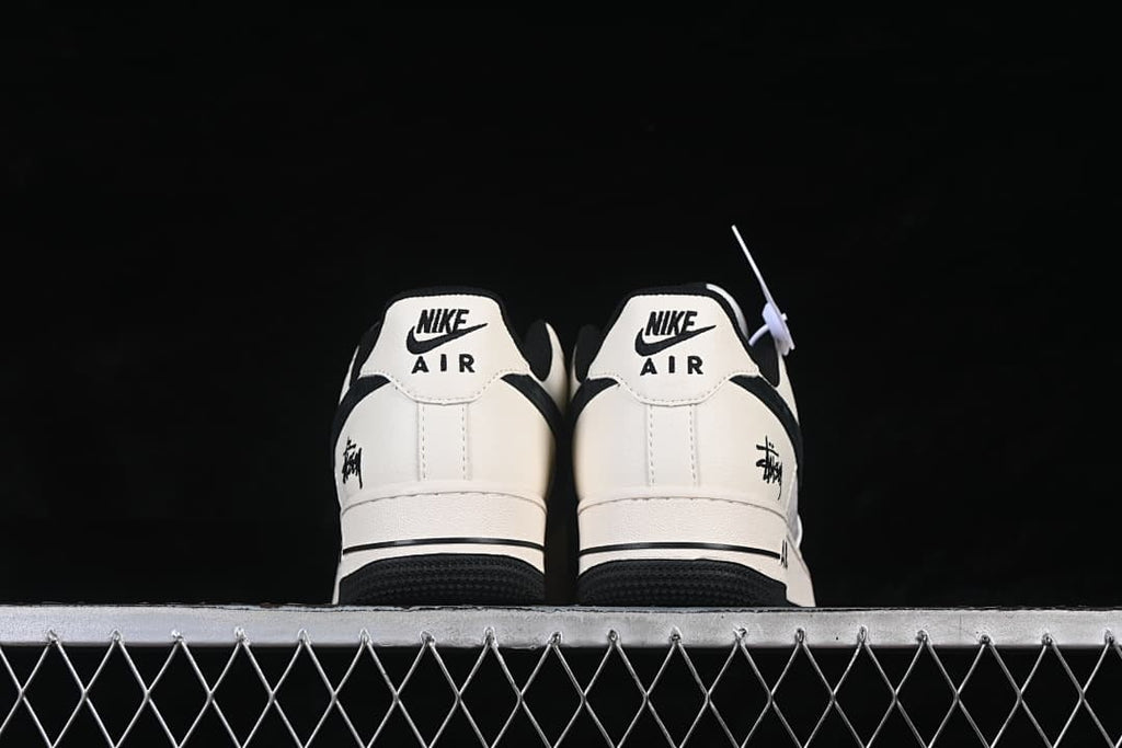 Rear view of the pair showing heel tabs and black outsole accents.