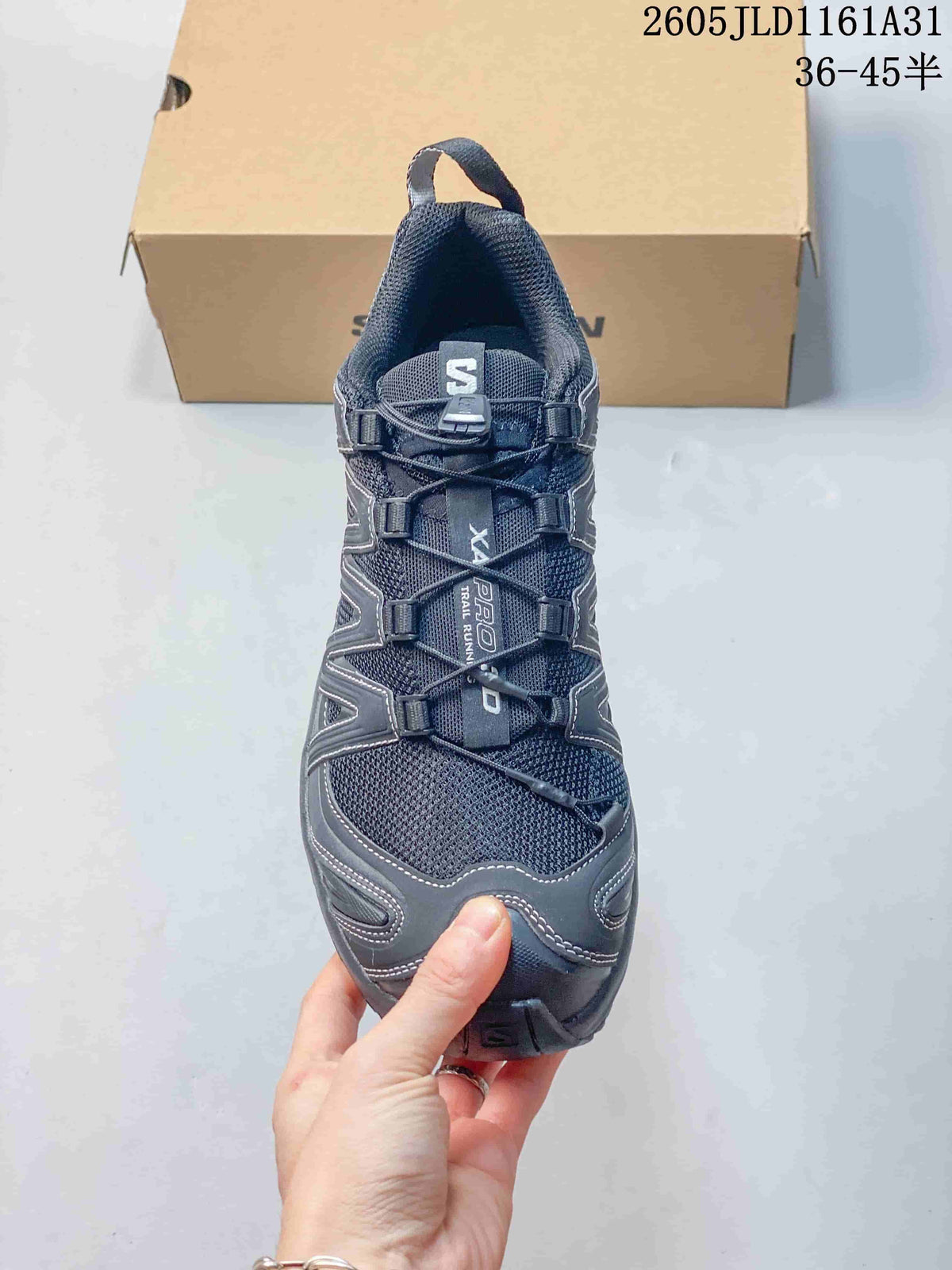 Front view of a dark gray Salomon XA Pro 3D sneaker showing its cord-lacing system.