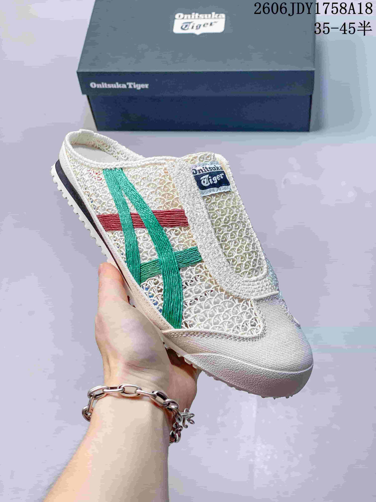 Angled side view of a cream Onitsuka Tiger Sabot slip-on sneaker