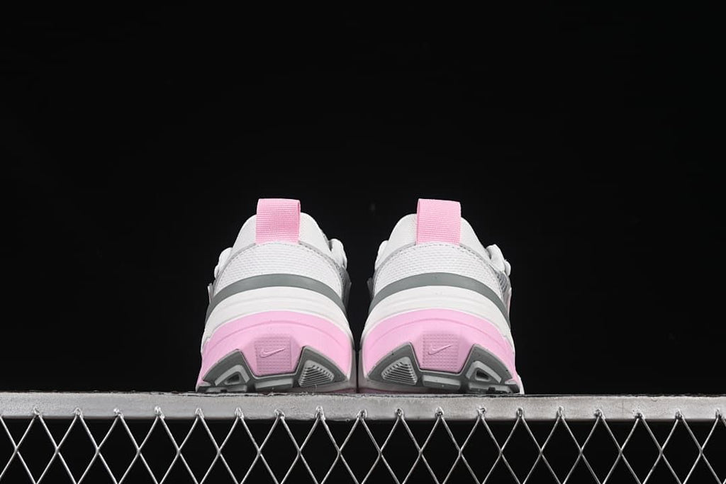 Rear view of the pair highlighting pink heel panels and gray outsole details