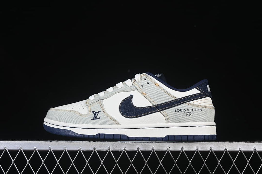 Side view of the low-top sneakers with pale blue panels and a navy Swoosh