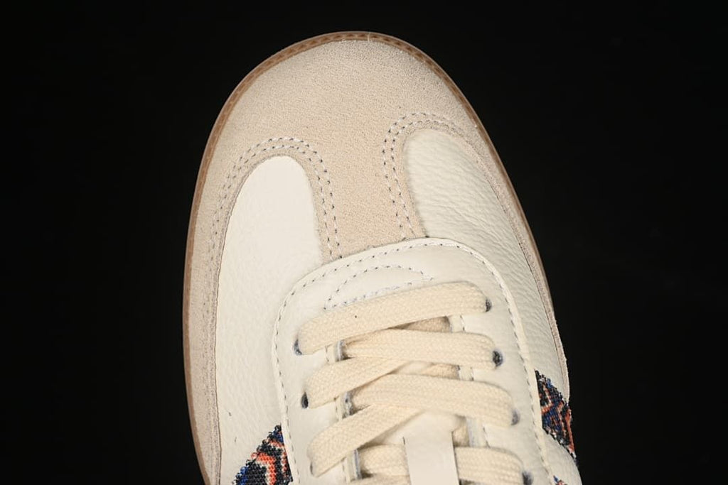 Top view of the cream toe, suede-look overlay, and laces