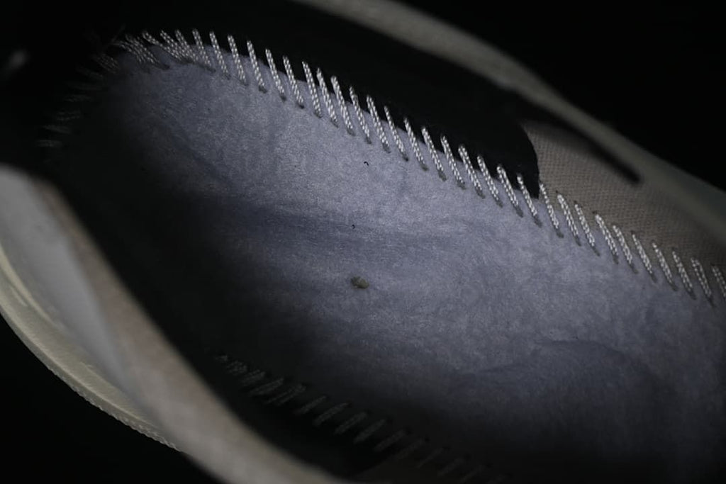 Close-up view inside the shoe showing the lining and stitched construction