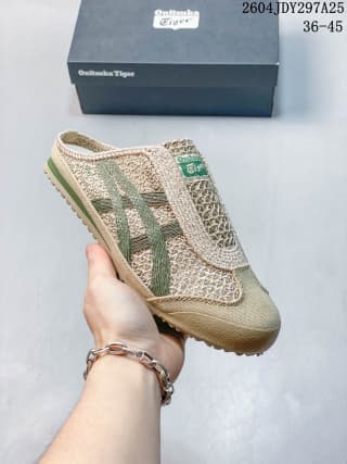 Angled side view showing the beige textured upper, green side stripes, and slip-on opening.