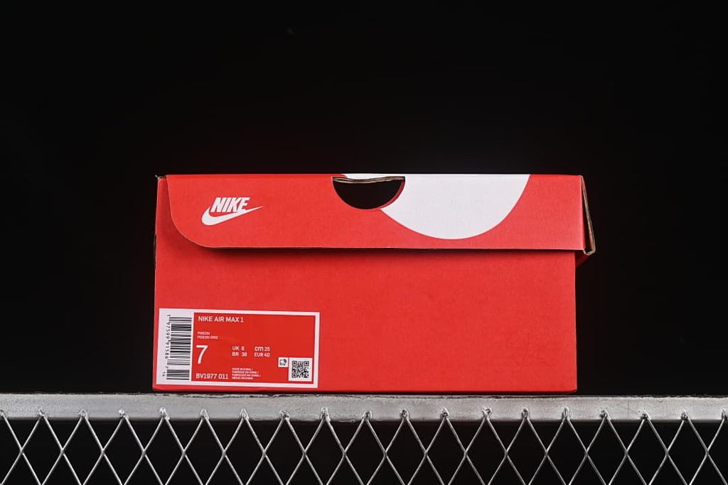 Red Nike shoe box label identifying Nike Air Max 1, style BV1977-011, and EU 40.
