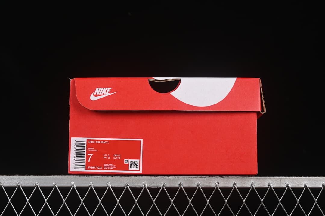 Red Nike shoe box label identifying Nike Air Max 1, style BV1977-011, and EU 40.