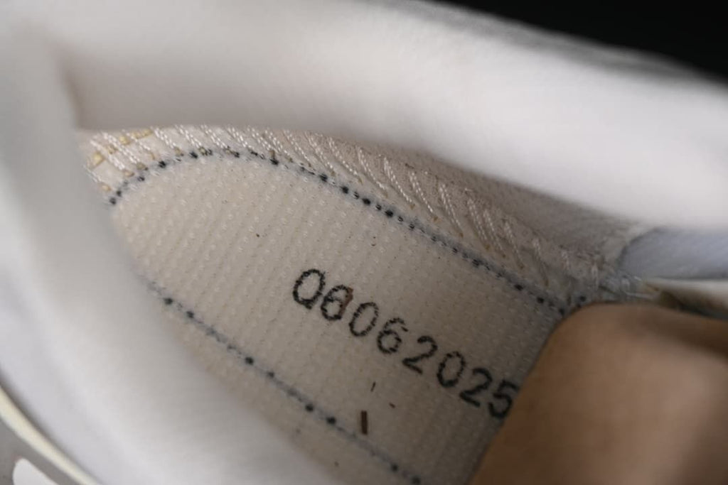 Interior shoe detail with a printed production code.