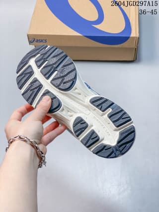 Underside view showing the segmented outsole with dark traction sections and white channels.