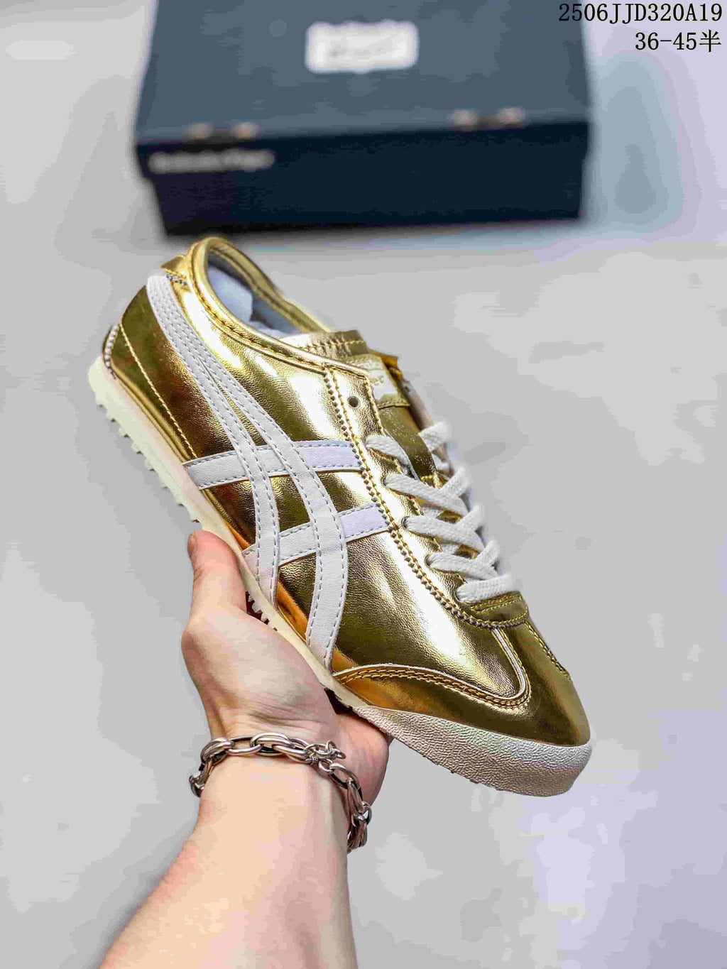 Metallic gold low-top sneaker with white side stripes and a light outsole