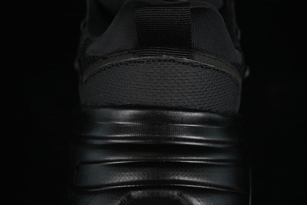 Rear view highlighting the heel and sculpted sole.