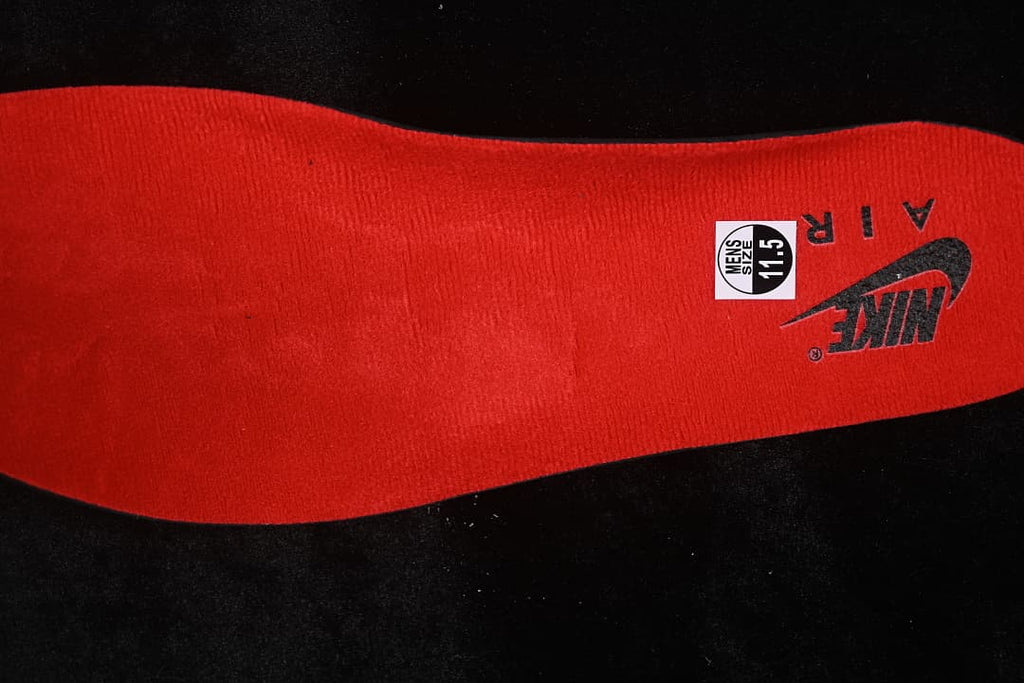 Red insole with a visible men's size 11.5 label