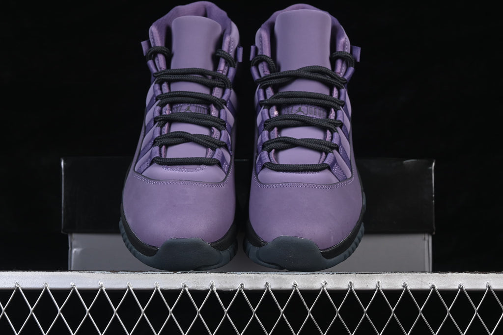 Front view of the pair of purple high-top sneakers with black laces.