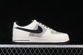 Side profile of a white, grey, and black low-top sneaker with patterned laces.