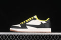 Side view of a black and white low-top sneaker with yellow laces and a light gum-colored outsole.