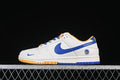 Side view of a white Nike SB Dunk Low with blue and gold-toned accents and Golden State Warriors heel branding.